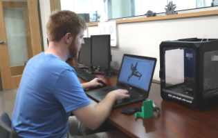 Man Typing on a Computer