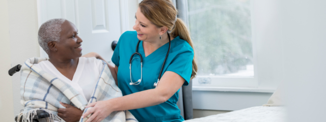 Female CNA Assisting a Female Patient in Wheelchair