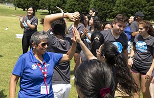 Woman giving a LIFE student a high five